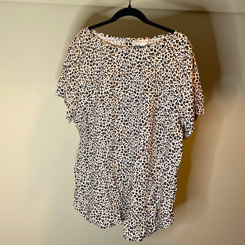 NWT. Animal print, cream, brown, and black top. Brand is Ava &Viv. Size 1x.
